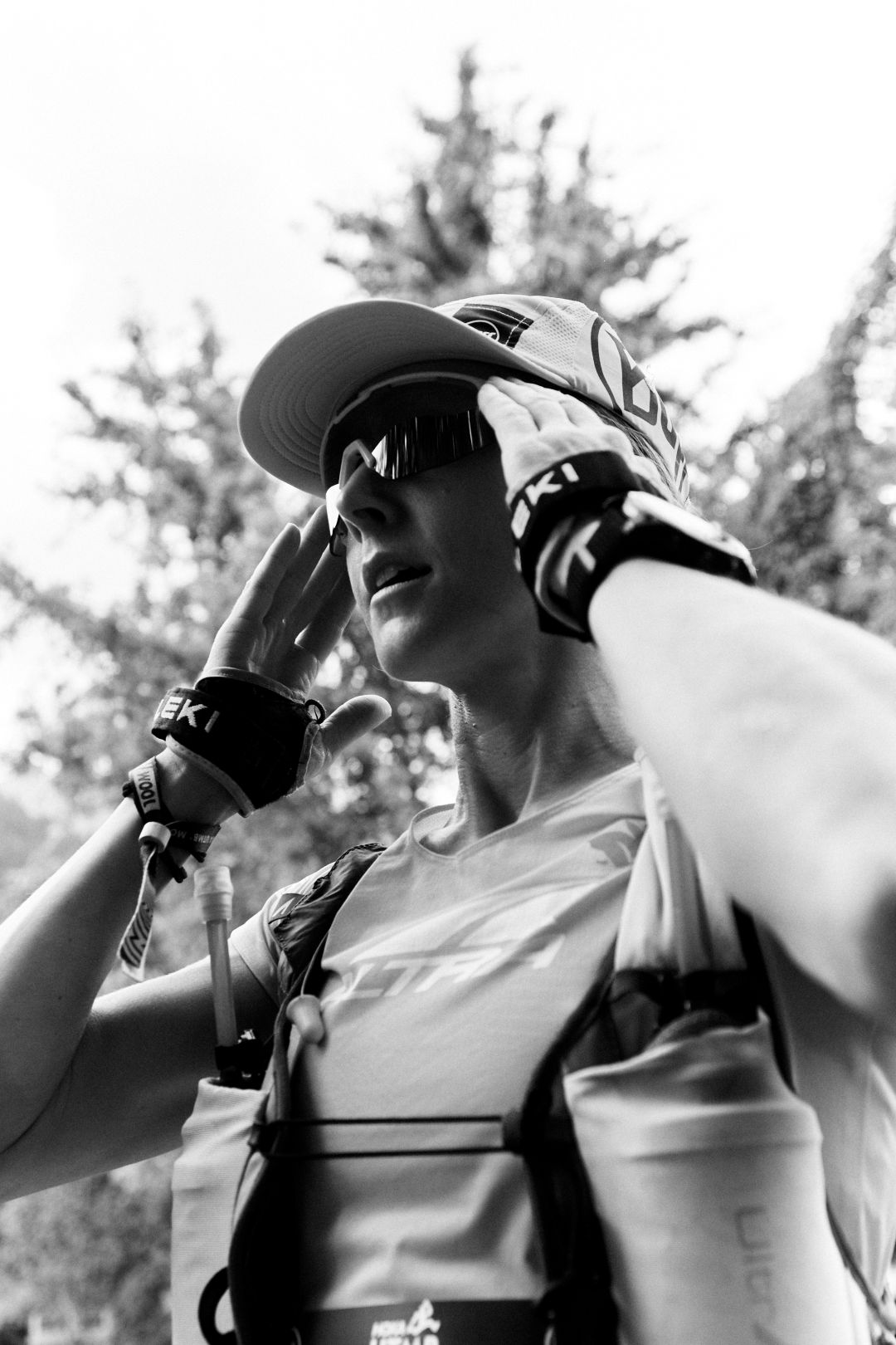 Close up of runner adjusting sunglasses